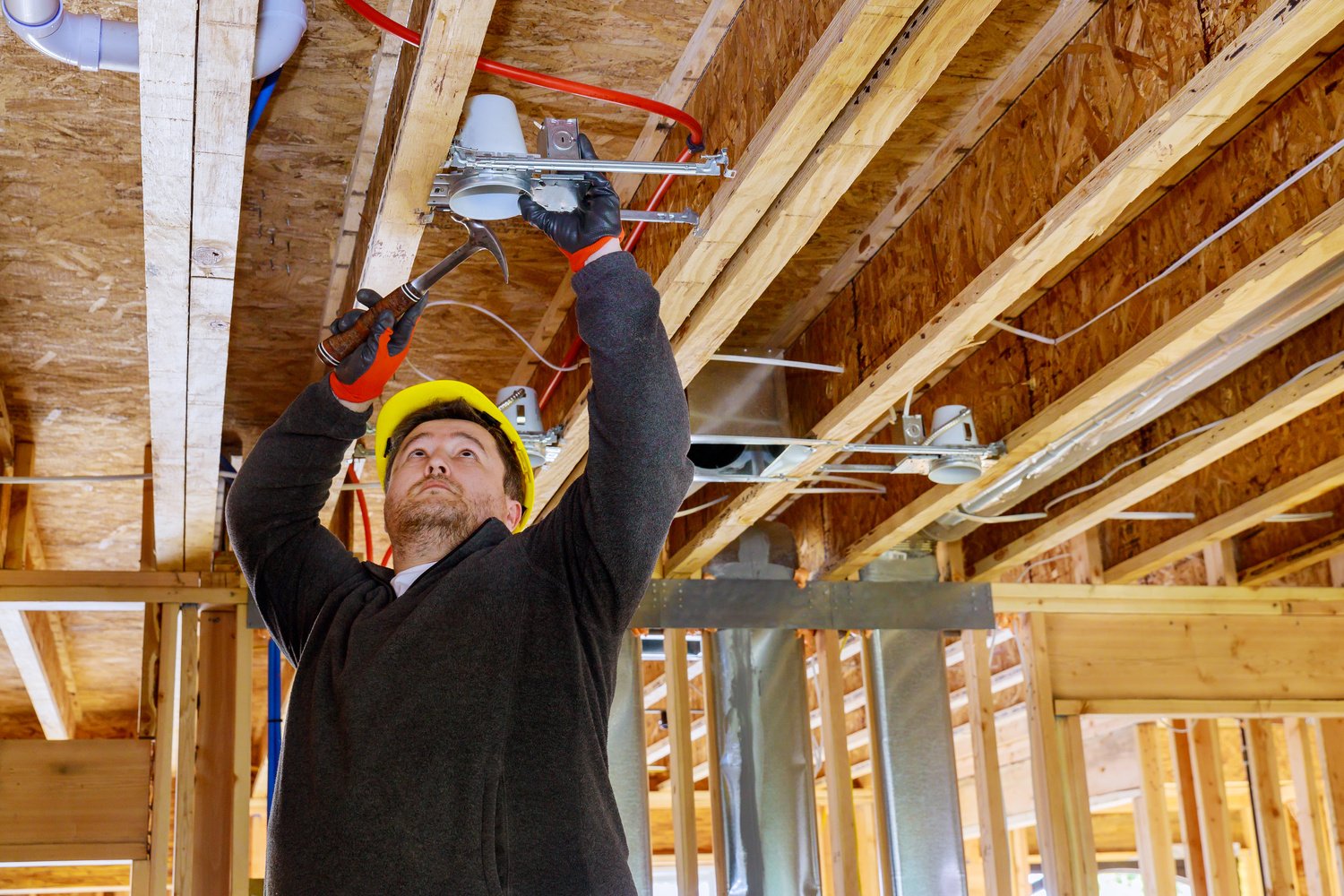 Electrician Installing the Lighting Lamp